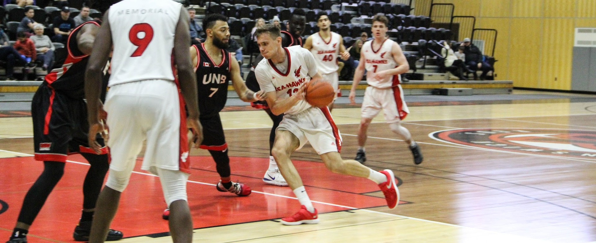 Hawks Drop 1st Game At UNB